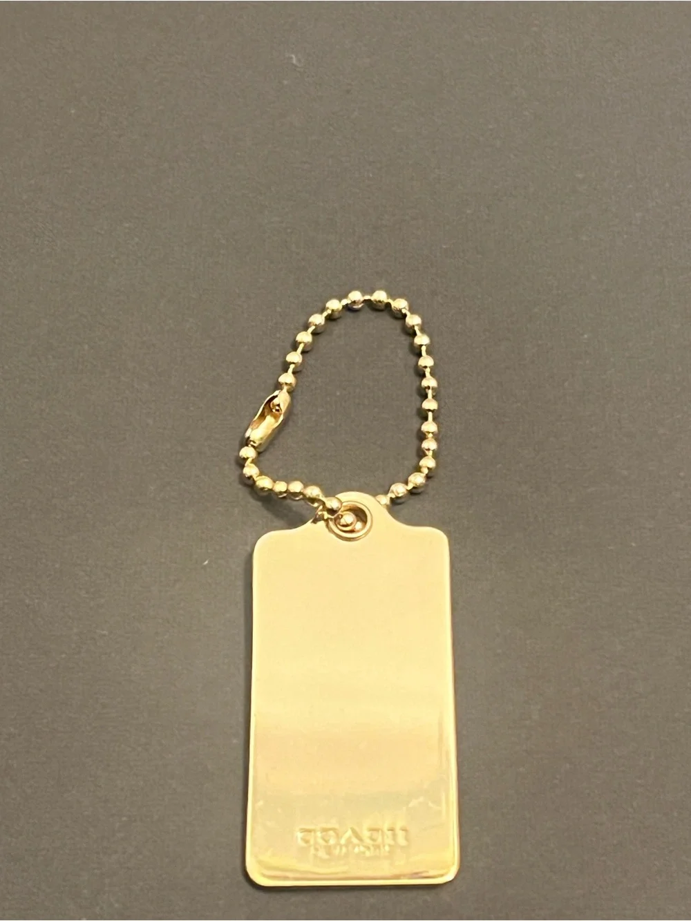 Rare Vintage Coach Gold Tone Embossed Horse & Carriage Dog-Tag Key Holder